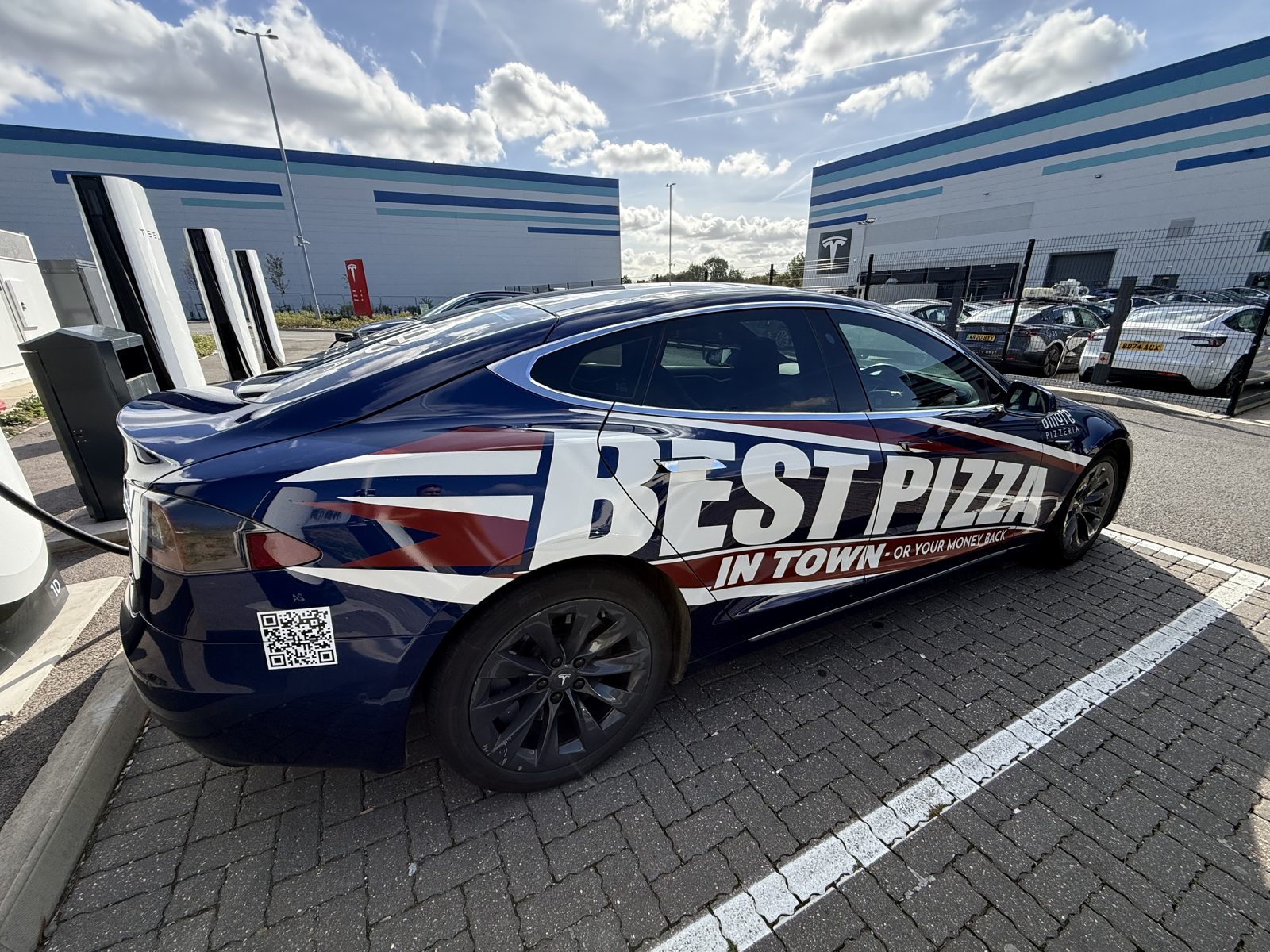 Amore Pizzeria blue car with Best Pizza in Town wrap