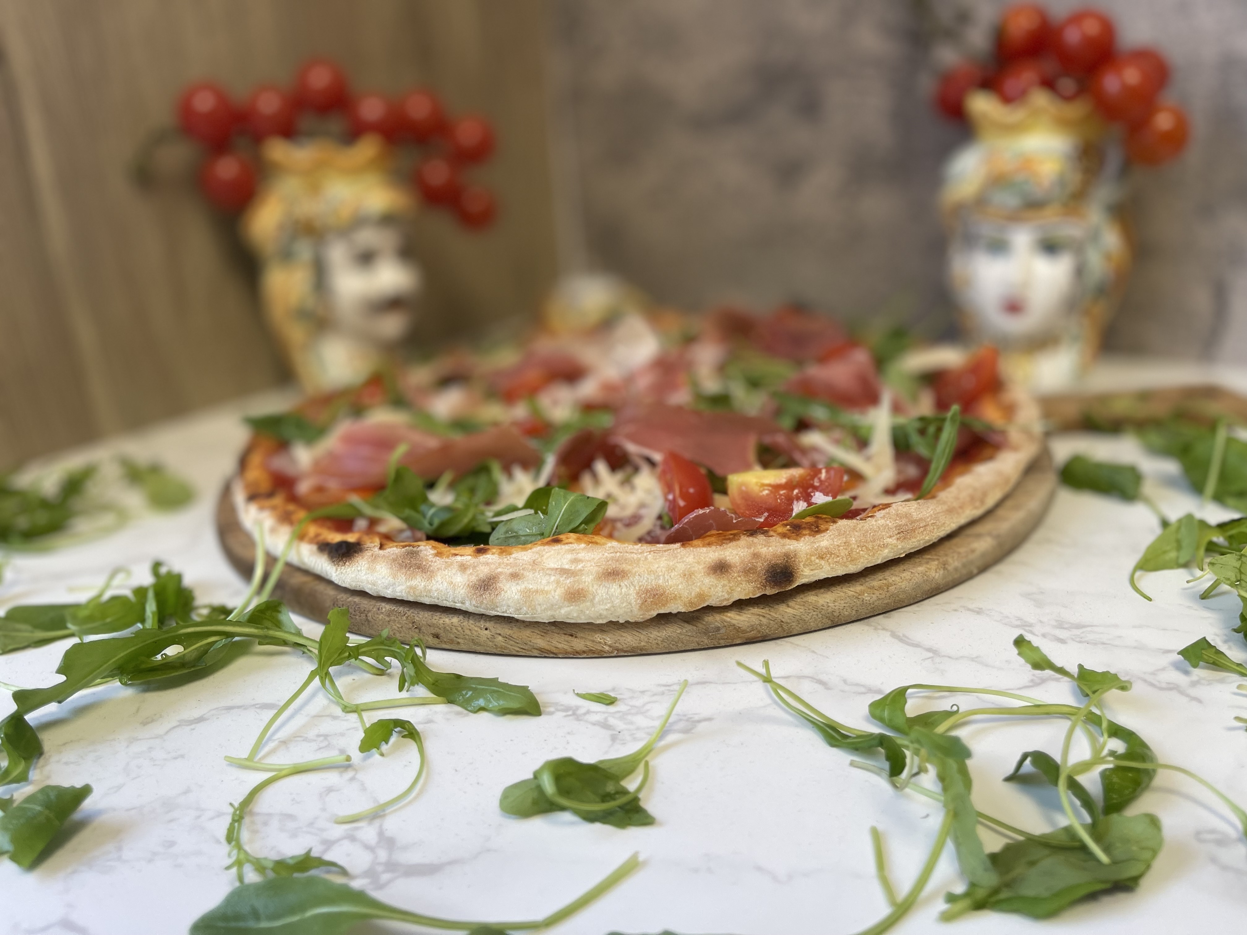 Amore Pizzeria signature prosciutto and arugula wood-fired pizza